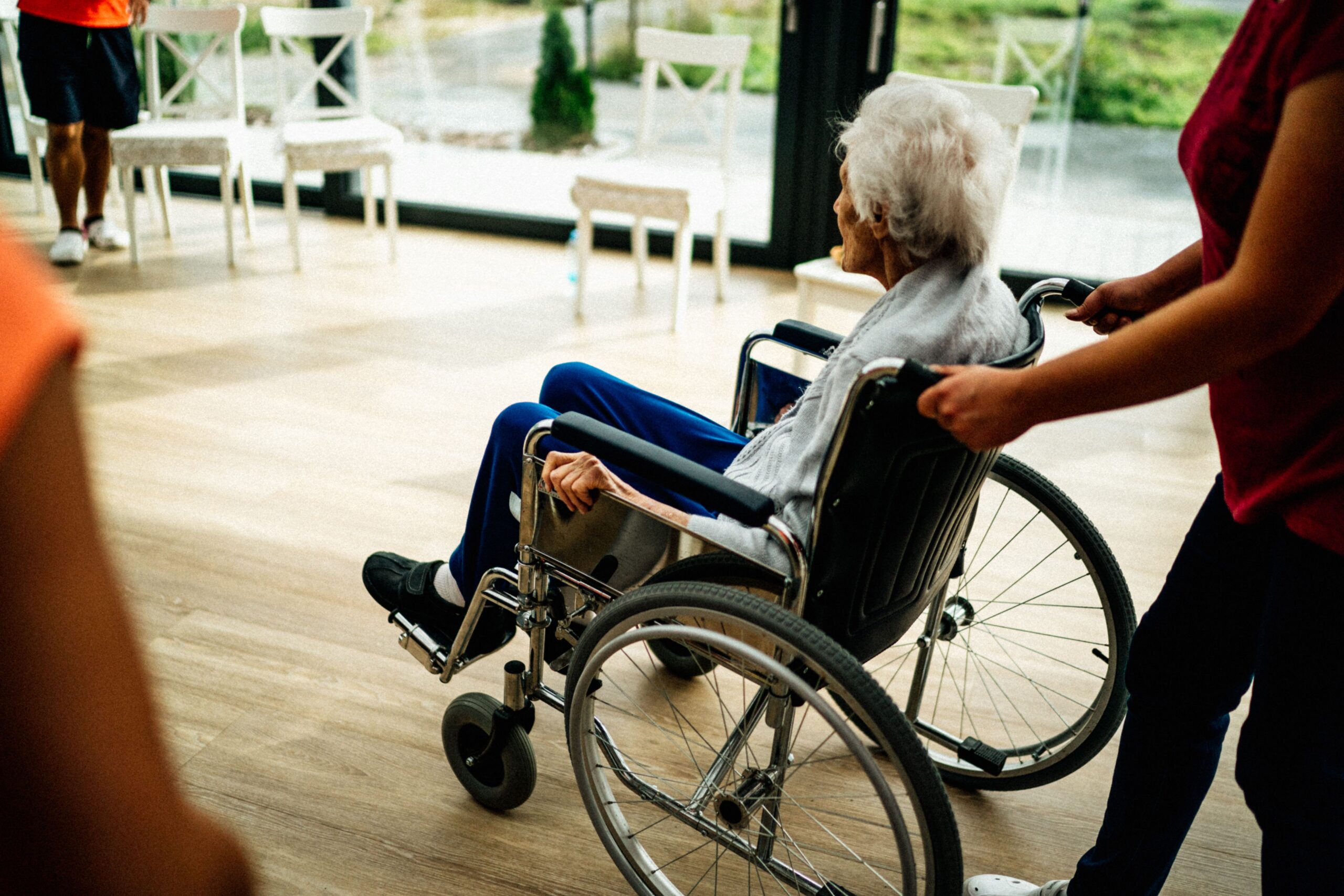 carer pushing wheel chair