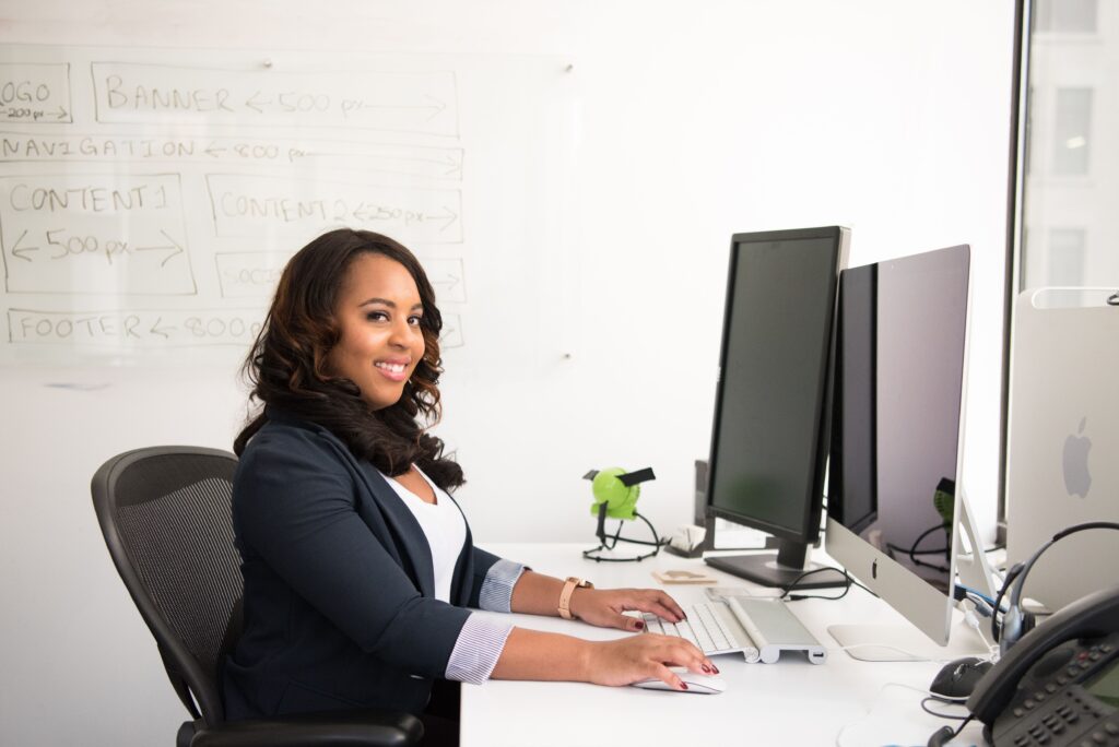 Care On Call team member working at an office desk